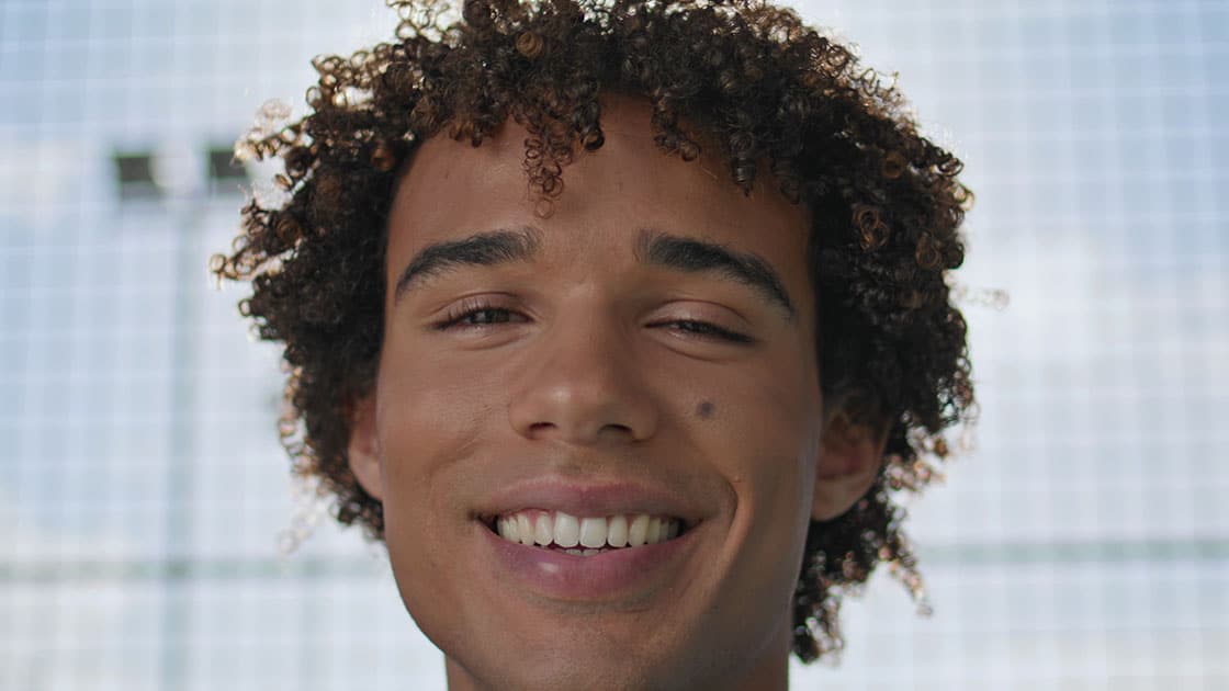 Smiling teenager with straight teeth